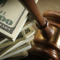 American Currency With Judge’s Gavel Stock Photo