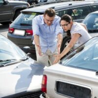 Drivers Arguing After A Car Accident Stock Photo