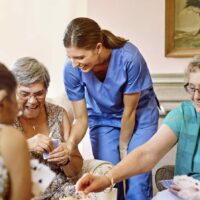 Elderly Women Playing Cards Stock Photo | Elder Abuse Lawyers
