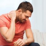 Neck Pain Stock Photo