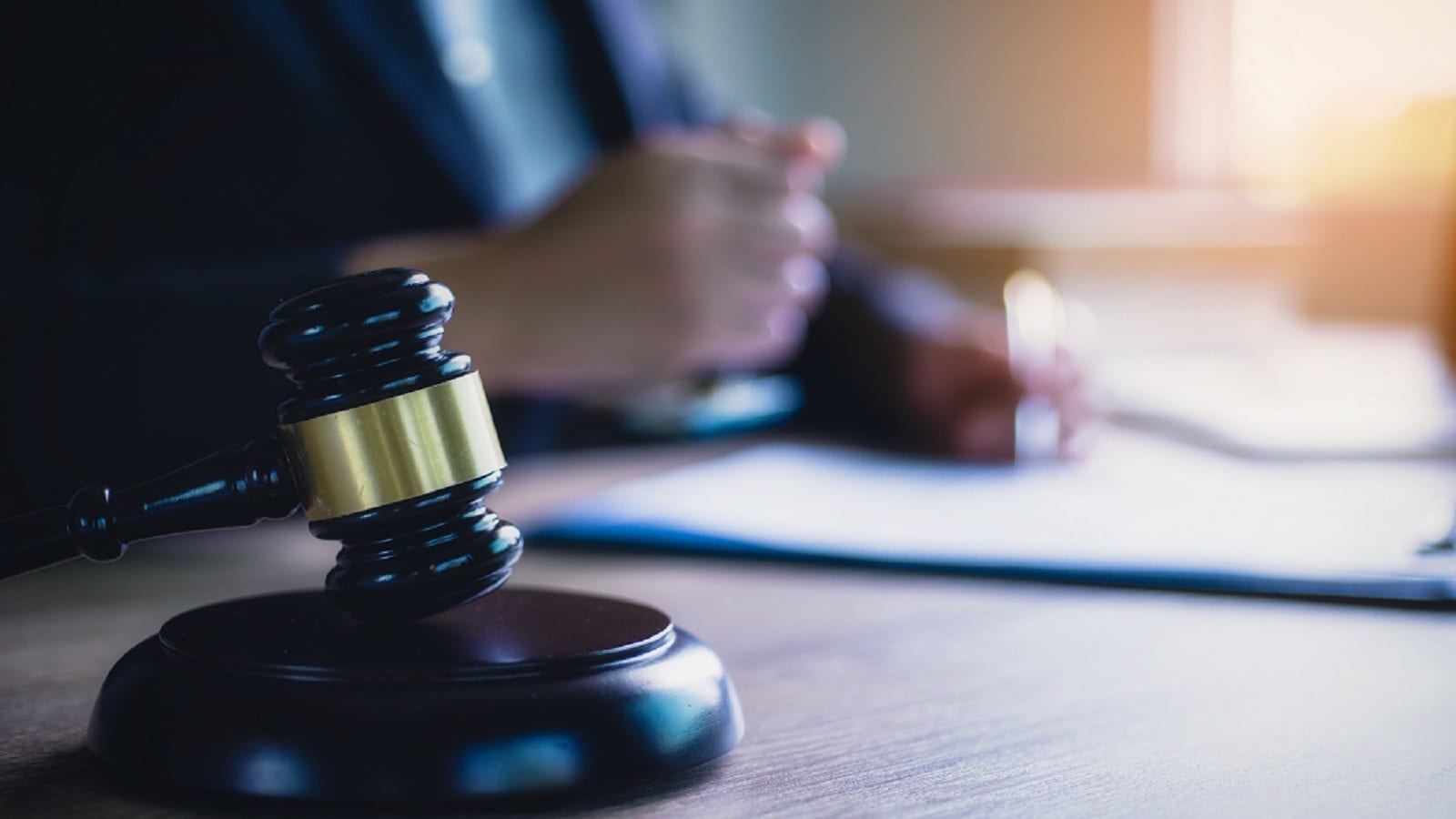 Judge Signing Documents In Office